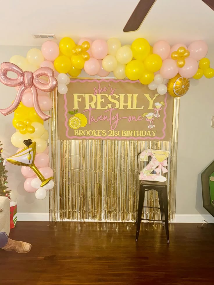 Freshly 21 birthday backdrop with bow and balloon arch