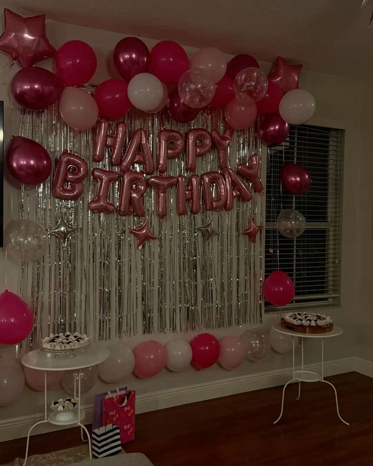 Pink Happy Birthday balloon backdrop with silver fringe
